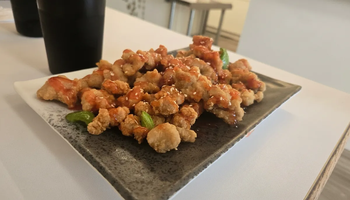Sweet and sour chicken with sesame seeds